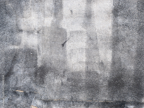 close-up photo of a texture of a scruffy gray painted wall.
