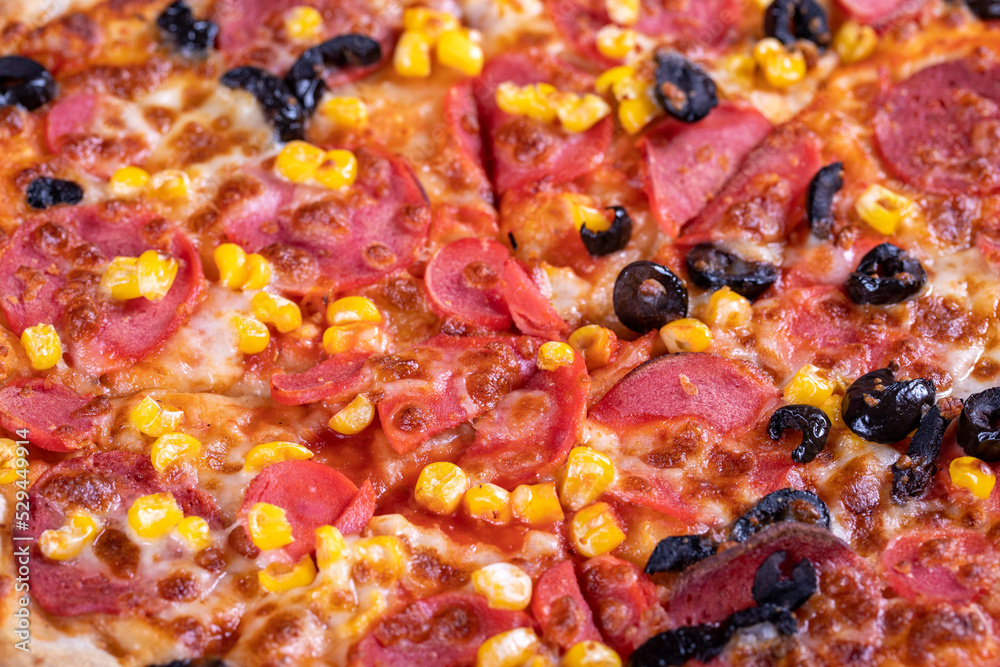 Pizza. Traditional Italian cuisine delicacies. mixed pizza on dark background Pizza. Traditional Italian cuisine delicacies. mixed pizza on dark background