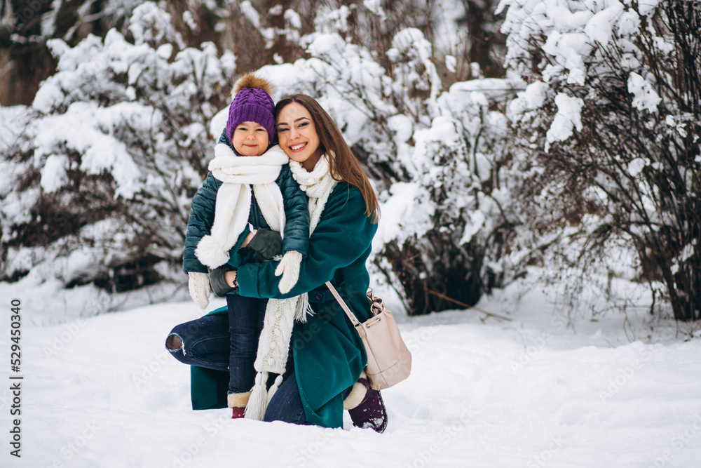 Mother and daughter in winter park Mother and daughter in winter park