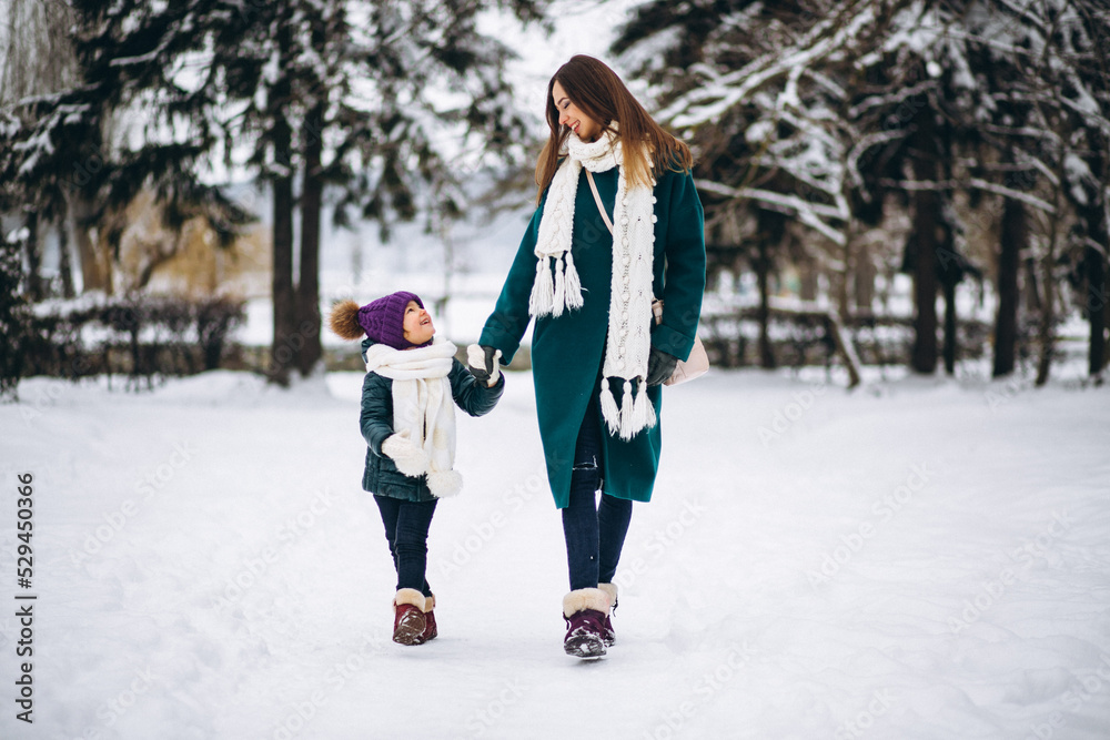 Mother and daughter in winter park Mother and daughter in winter park