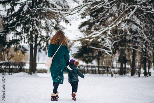 Mother and daughter in winter park