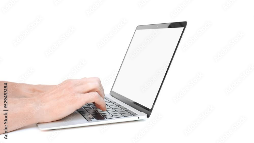 a businessman working in an office with large windows. a businessman working in an office with large windows.