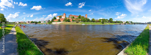 Old houses and towers behind the fortress wall on the banks of the river.