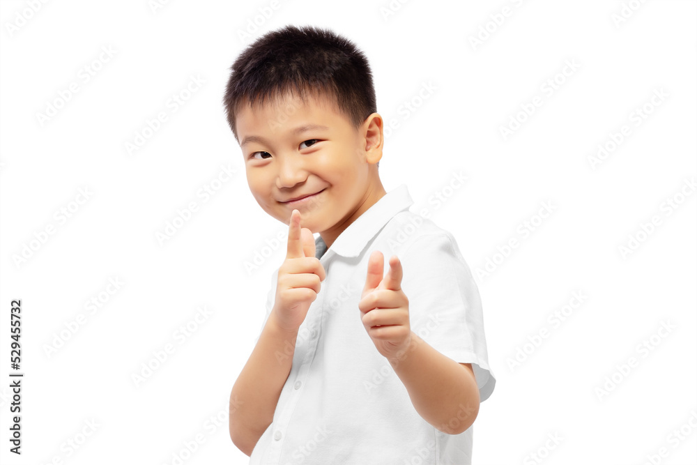 Smiling kid with correct hand sign, pointing to camera, wearing white shirt Smiling kid with correct hand sign, pointing to camera, wearing white shirt