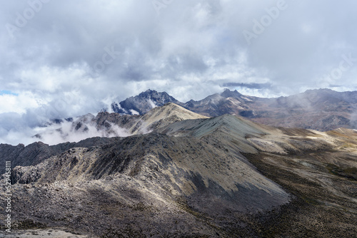From the pan de azucar peak with an altitude of 4,680 above sea level in the national park sierra de la Culata with a view of two other peaks called pan quemado and pan de sal.