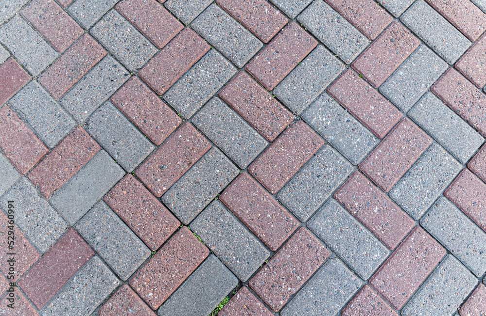 Texture of red-gray street pavers. Road surface. Texture of red-gray street pavers. Road surface.