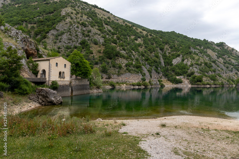 Lake of San Domenico in Abruzzo, Italy and the Eremo di San Domenico in the background.
