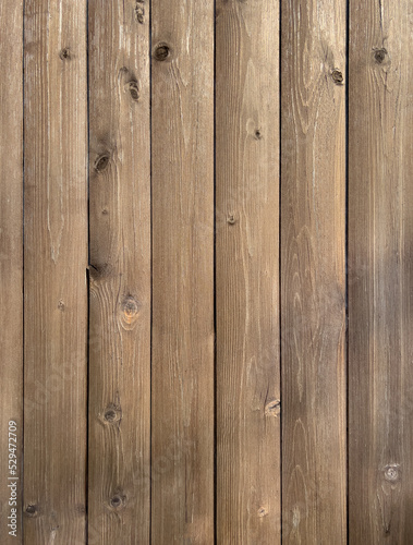 Vertical wooden planks with knots. Wooden background.