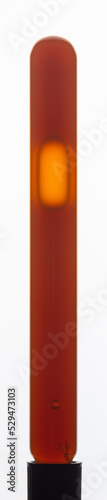 Free Download Yellow viscous liquid sunflower lecithin with bubbles in a transparent test tube on a white background - GFXLoad