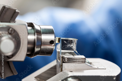 Closeup of an epoxy embedded tissue placed on the ultramicrotome to make sections for the electron microscope