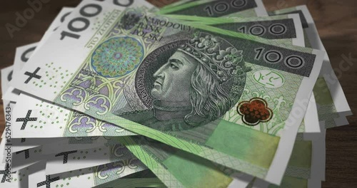 Zloty 100 PLN banknotes falling on the table. Poland currency paper notes count on stack. Timelapse of money counting. 3D concept.