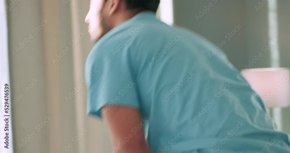 Sleeping man, wake up from bedroom and window curtains open on sunny morning at home. Young guy, lazy person and starting healthy, sunshine and lifestyle day with energy after tired relaxing in house Sleeping man, wake up from bedroom and window curtains open on sunny morning at home. Young guy, lazy person and starting healthy, sunshine and lifestyle day with energy after tired relaxing in house