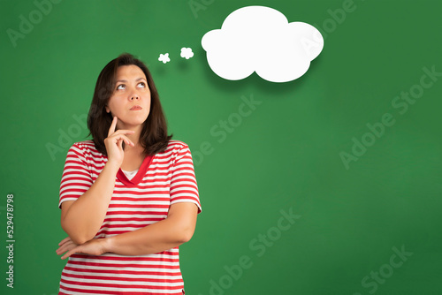 Clouds of thought with overweight woman in a thoughtful face