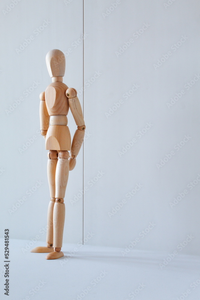 Concept of waiting to stand or rest on the street with a wooden doll as a model Concept of waiting to stand or rest on the street with a wooden doll as a model