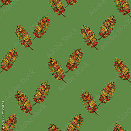 Seamless pattern of autumn rowan leaves on green background. Vector image. Doodle style.