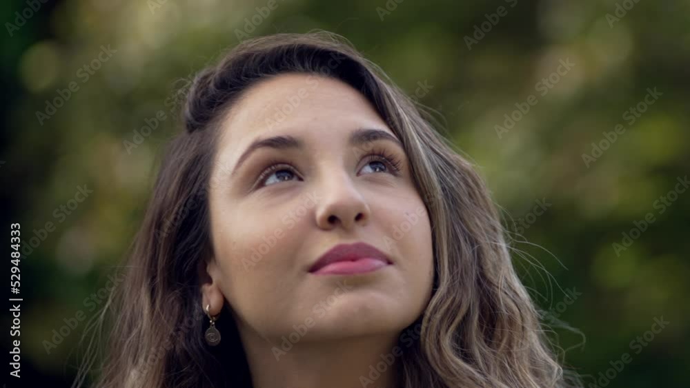 One hispanic young woman looking up at sky smiling with HOPE and FAITH. Spiritual 20s adult girl closeup face One hispanic young woman looking up at sky smiling with HOPE and FAITH. Spiritual 20s adult girl closeup face