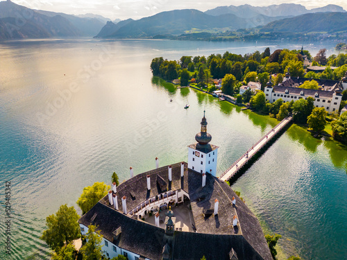 Schloss Ort (or Schloss Orth) is an Austrian castle situated in the Traunsee lake, in Gmunden. Aerial drone view. photo