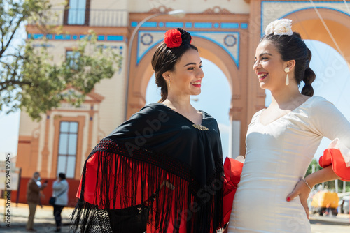 Cheerful Spanish women during fair in park