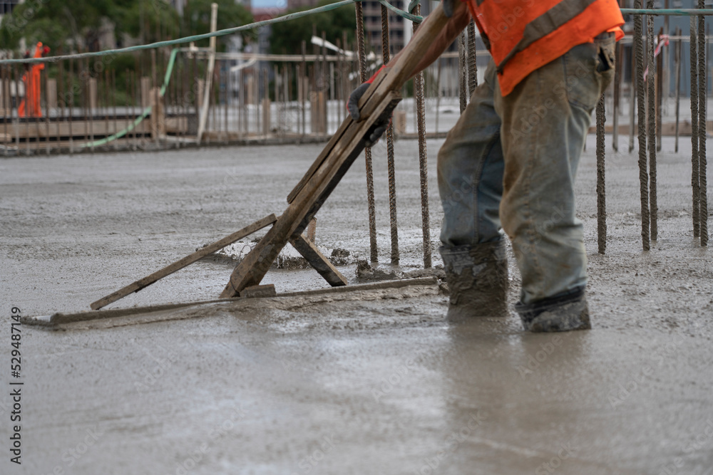 grouting poured concrete at a construction site