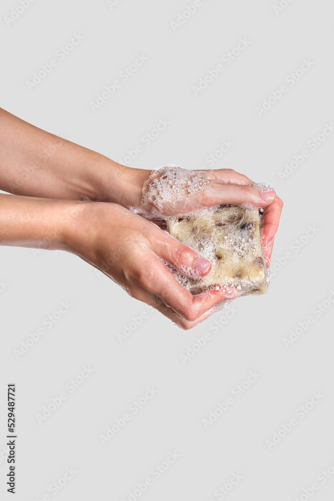 Woman holding handcrafted soap. Soap to wash hands, concept of hygiene to protective pandemic coronavirus. Spa products