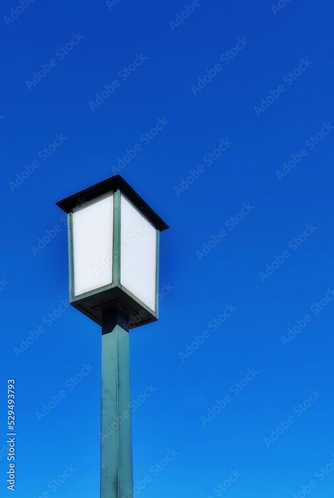 street lamp on blue sky