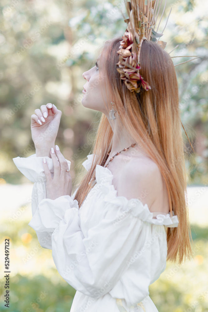 Obraz premium Bride of the sun in white in the apple trees