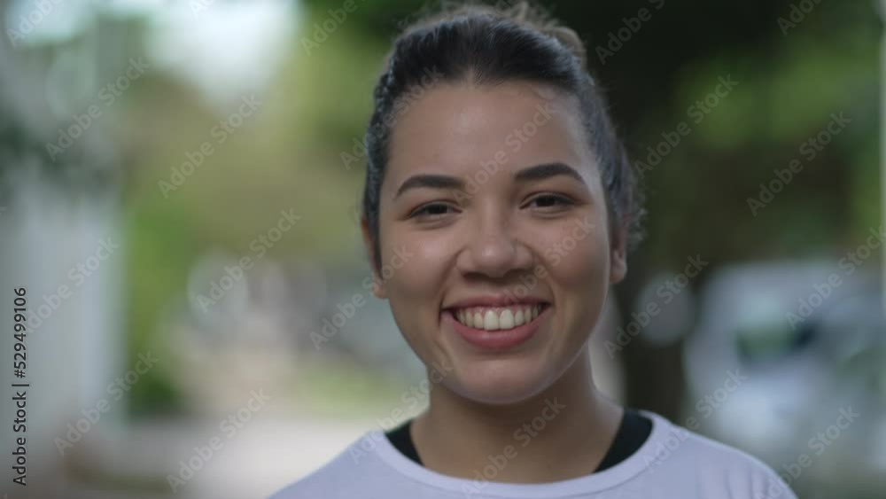 Portrait of a smiling casual young woman. A hispanic South American 20s girl closeup face Portrait of a smiling casual young woman. A hispanic South American 20s girl closeup face