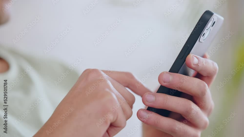 Social media, streaming and texting on a phone with a man relax and rest at home. Closeup of male hands typing, watching online entertainment or browsing online for fun things to enjoy on weekend Social media, streaming and texting on a phone with a man relax and rest at home. Closeup of male hands typing, watching online entertainment or browsing online for fun things to enjoy on weekend
