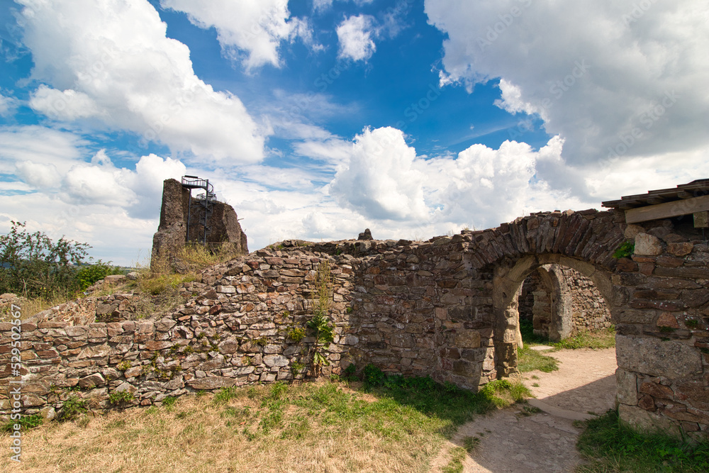 Ruins of Lichnice castle in summer cloudy day. Czech Republic.