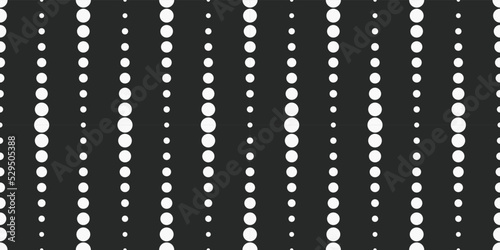 White circles in a row vertically. Dotted line design made up of dots on a black background.