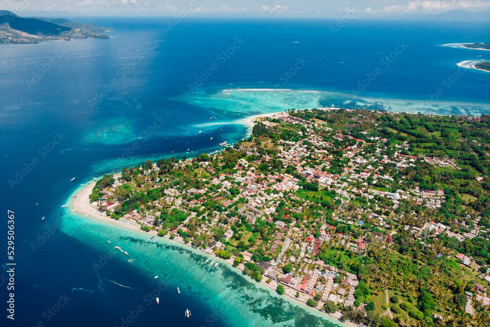 Tropical island with beach and ocean, aerial view. Popular Gili islands