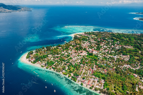 Tropical island with beach and ocean, aerial view. Popular Gili islands