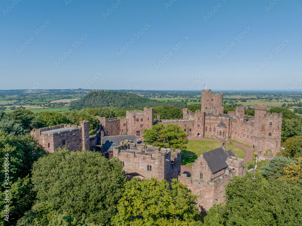 Peckforton Castle Cheshire, historic castle in rural Cheshire north west England, United Kingdom. Aerial view of the castle and wedding venue by drone