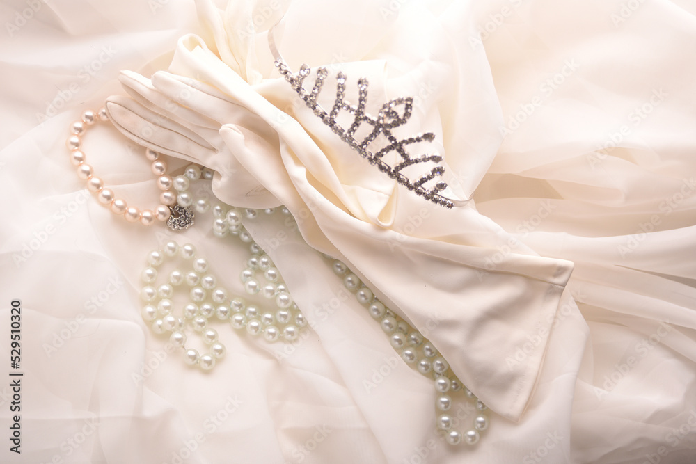 glove and crown on white glove and crown on white