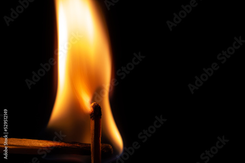 match on fire on a black background