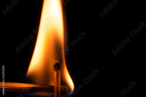 match on fire on a black background