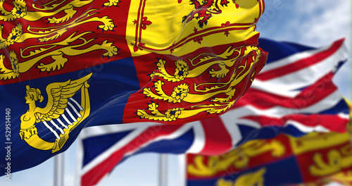Φωτογραφία The Royal Standard of the United Kingdom waving the wind along with the UK flag