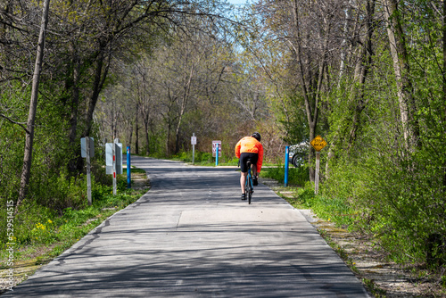A Bicycle Rider On The Fox River Trail Near De Pere, Wisconsin