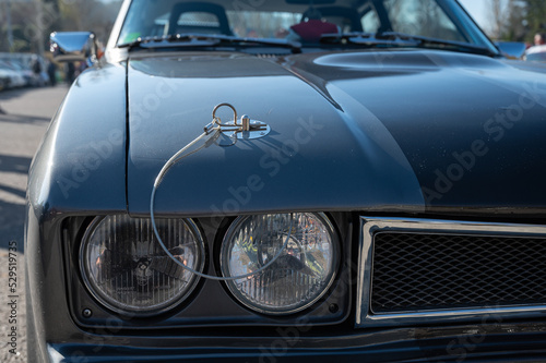 Detail of an old sports car, gray Ford Capri with two black stripes © Adolf