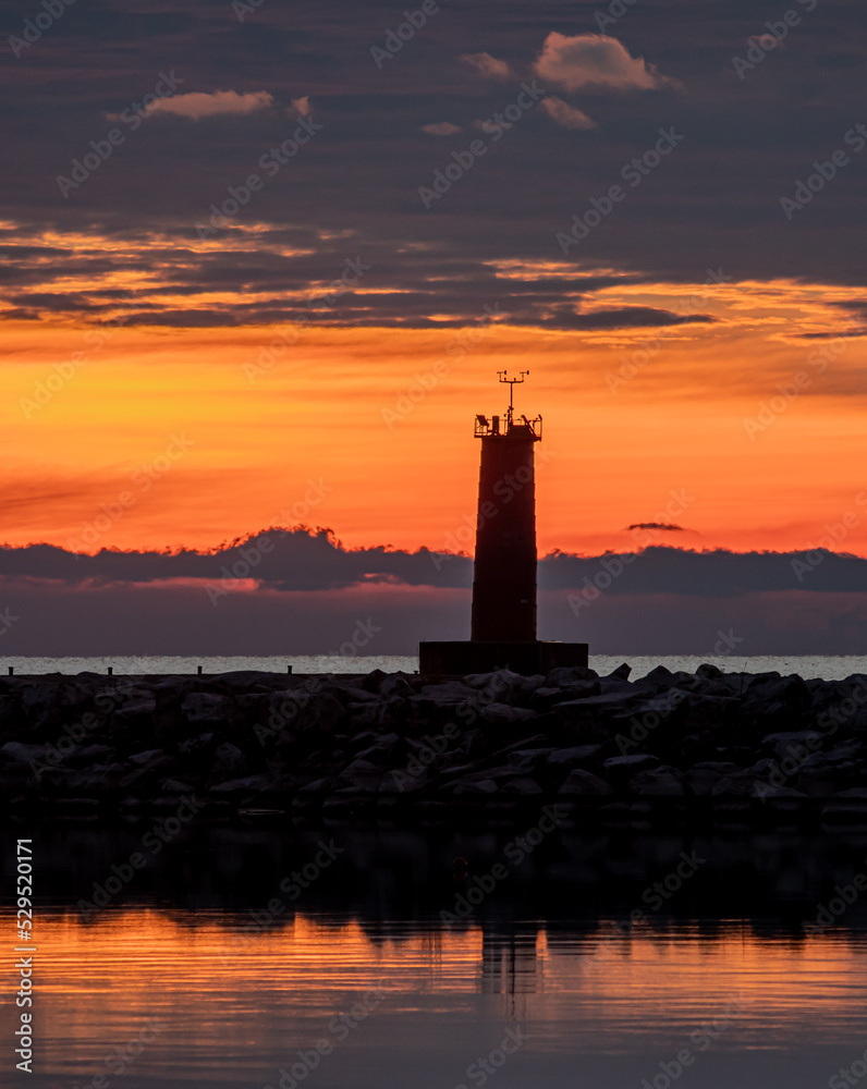 Lighthouse orange sunset silhouette