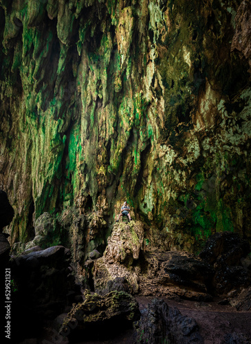 portrait of a men inside a green cave in Santander, Colombia