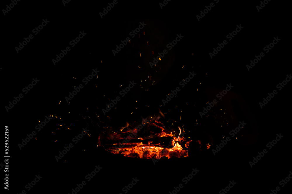 Campfire flame sparks isolated on black background. Fire flames heat energy heap in the night. Fire sparkles isolated on black Campfire flame sparks isolated on black background. Fire flames heat energy heap in the night. Fire sparkles isolated on black