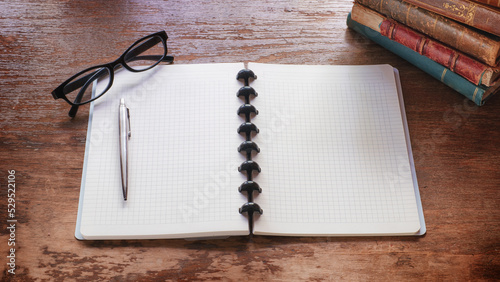 Open notebook with a pen an...