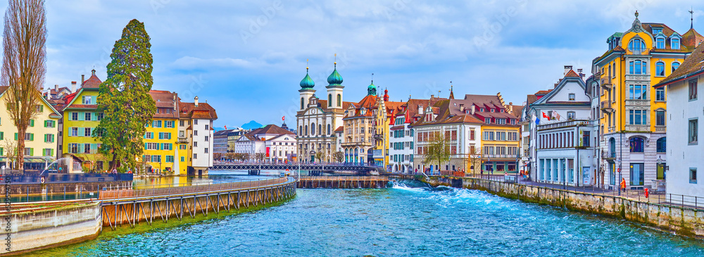 The townscape of medieval Lucerne with Needle Dam and Jesuit Church on background, Switzerland