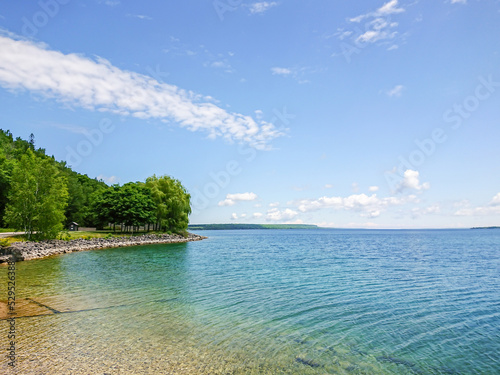 Landscape of the Huron Lake water and greenery at day in Georgian Bay near Spirit Rock Conservation Area at Wiarton, Ontario, Canada. photo