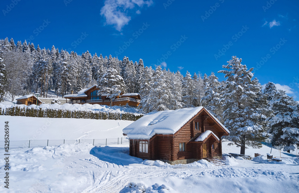 Wooden camping house in a snowy forest in the mountains Wooden camping house in a snowy forest in the mountains