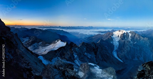 Sunrise on the summit climb of the Grand Combin. View of the Mont Vélan mountain. mountaineering in the valais mountains, switzerland. Wonderful mountain panorama with a view of the Mont Blanc massif