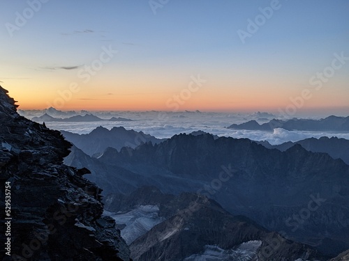 Mountaineering at sunrise. Wonderful view of the Alps with the first rays of the sun. Grand Combin Valais. High quality photo