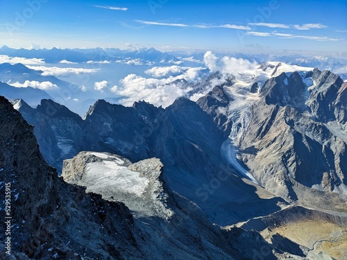 Mountaineering on the Grand Combin. Wonderful view at the top with many glaciers and mountains. High-altitude tour in the european alps. Valais Switzerland. High quality photo