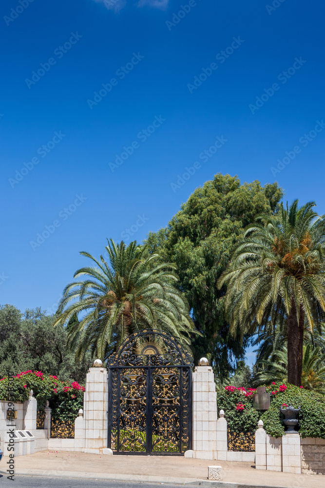 Haifa, Israel, July 12, 2022 : The decorative metal gate at the entrance to the middle terrace of the Bahai Garden, located on Mount Carmel in the city of Haifa, in northern Israel